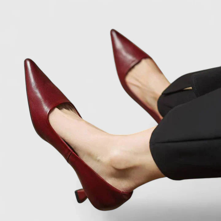 Burgundy pointed-toe slingback kitten heels with elastic back strap — side view on model