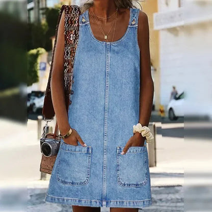 Women's sleeveless denim mini dress with front pockets and center seam detail — front view