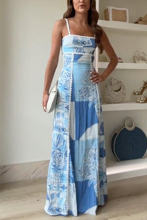Blue and white patchwork maxi dress with bow-back straps and fitted bodice — front view
