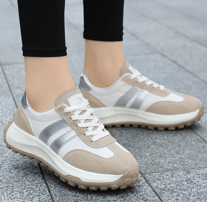 Women's beige and white orthopedic sneakers with silver stripes — three-quarter front view