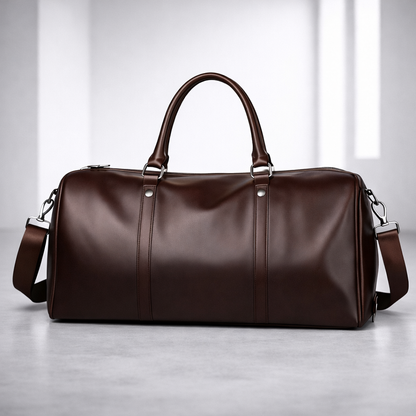 Brown full-grain leather duffle bag with dual handles and shoulder strap — front view