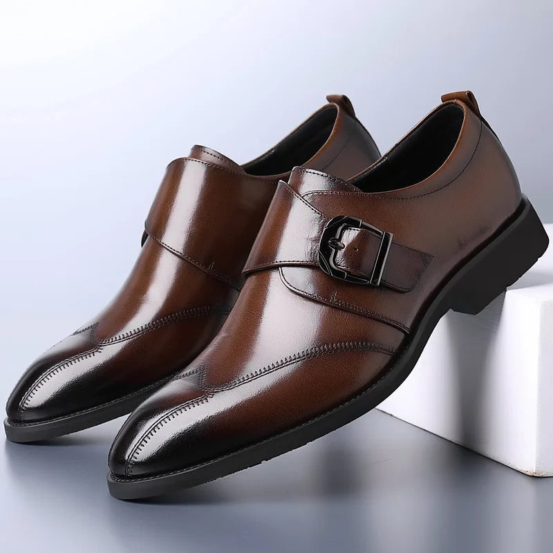 Brown monk strap dress shoes with buckle detail and burnished toe — three-quarter front view