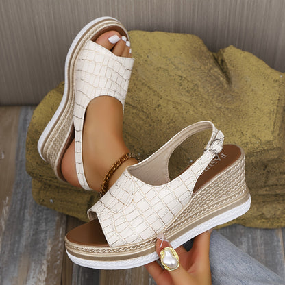 White croc-embossed wedge espadrille sandals with platform sole — angled front view on model