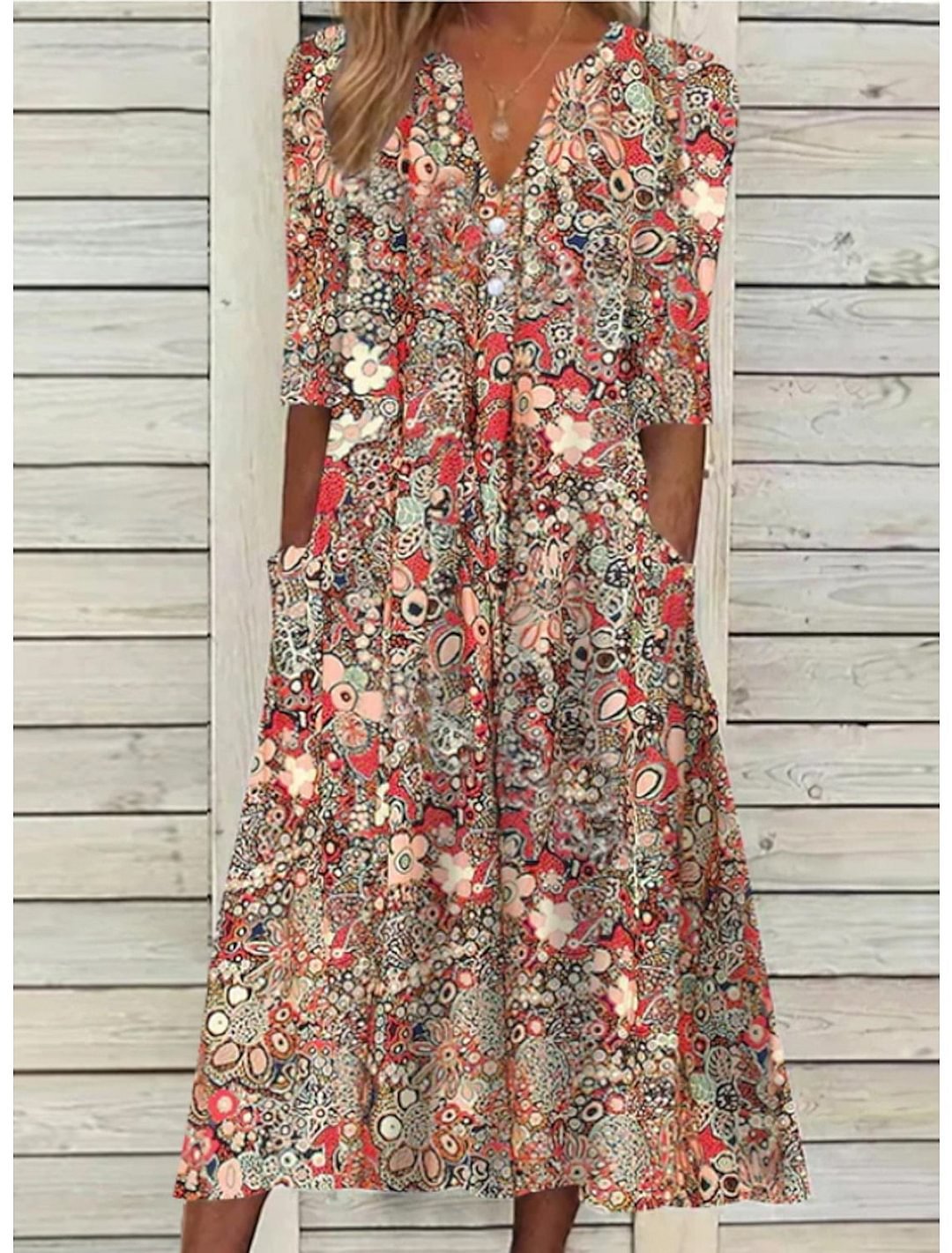 Women's V-neck midi dress with colorful abstract floral print — front view