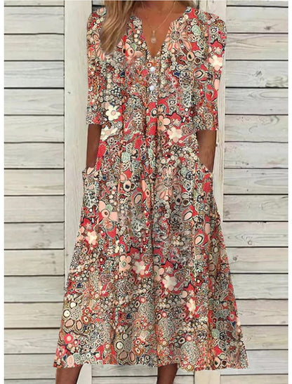 Women's V-neck midi dress with colorful abstract floral print — front view