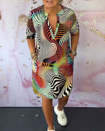 Colorful geometric wave print V-neck shirt dress with short sleeves — front view