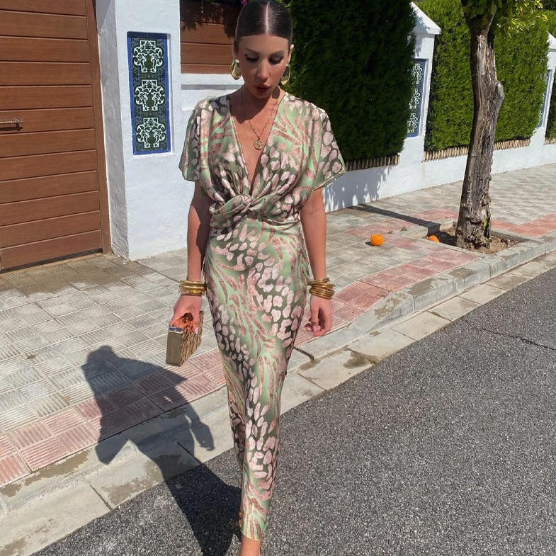 Floral print wrap maxi dress with V-neckline and short sleeves — front view on model outdoors