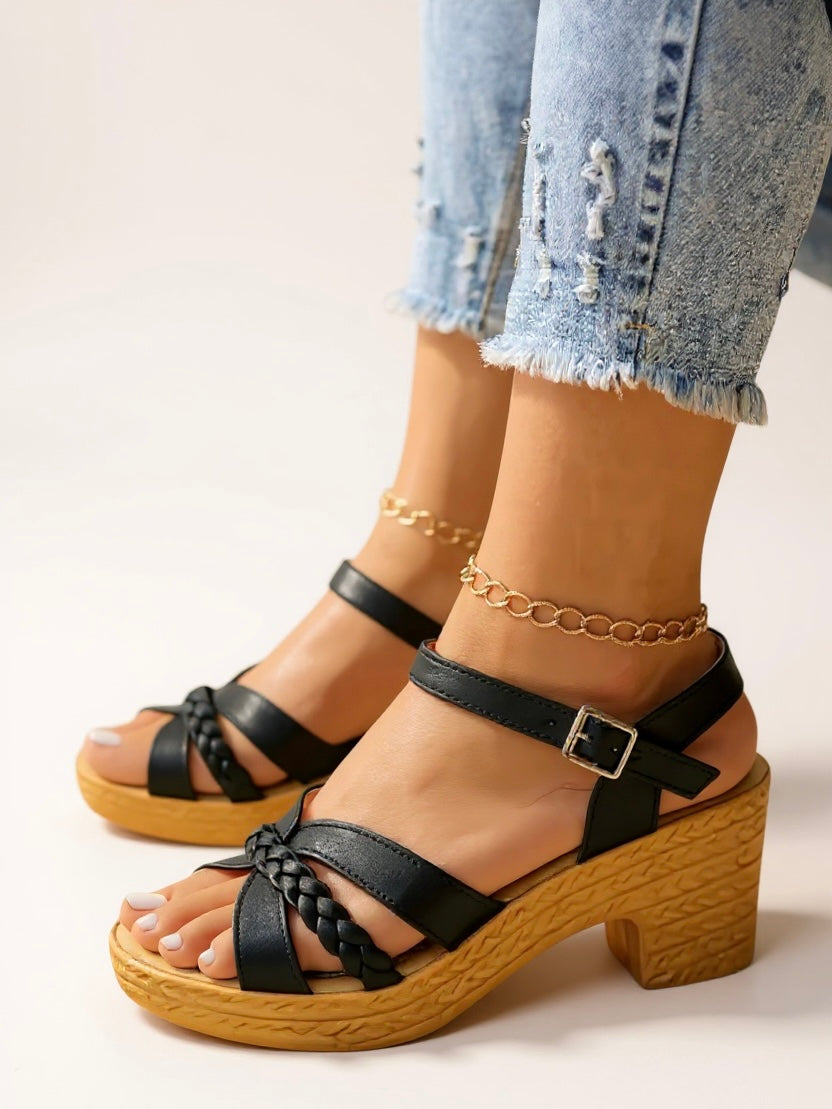 Women's black woven strap sandals with wood-look block heels and platform — three-quarter front view