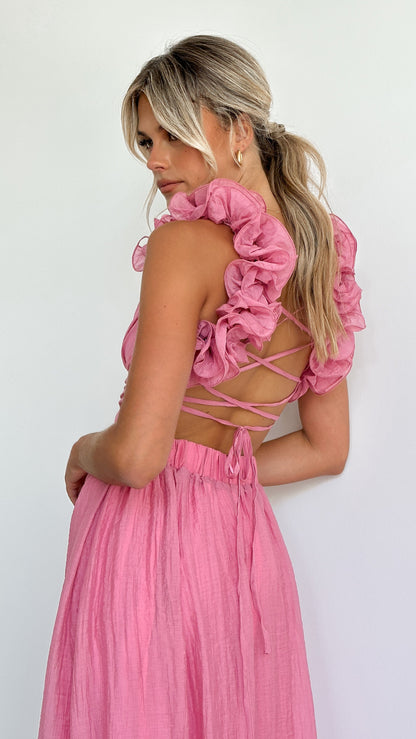 Pink ruffle-strap maxi dress with lace-up open back — rear three-quarter view