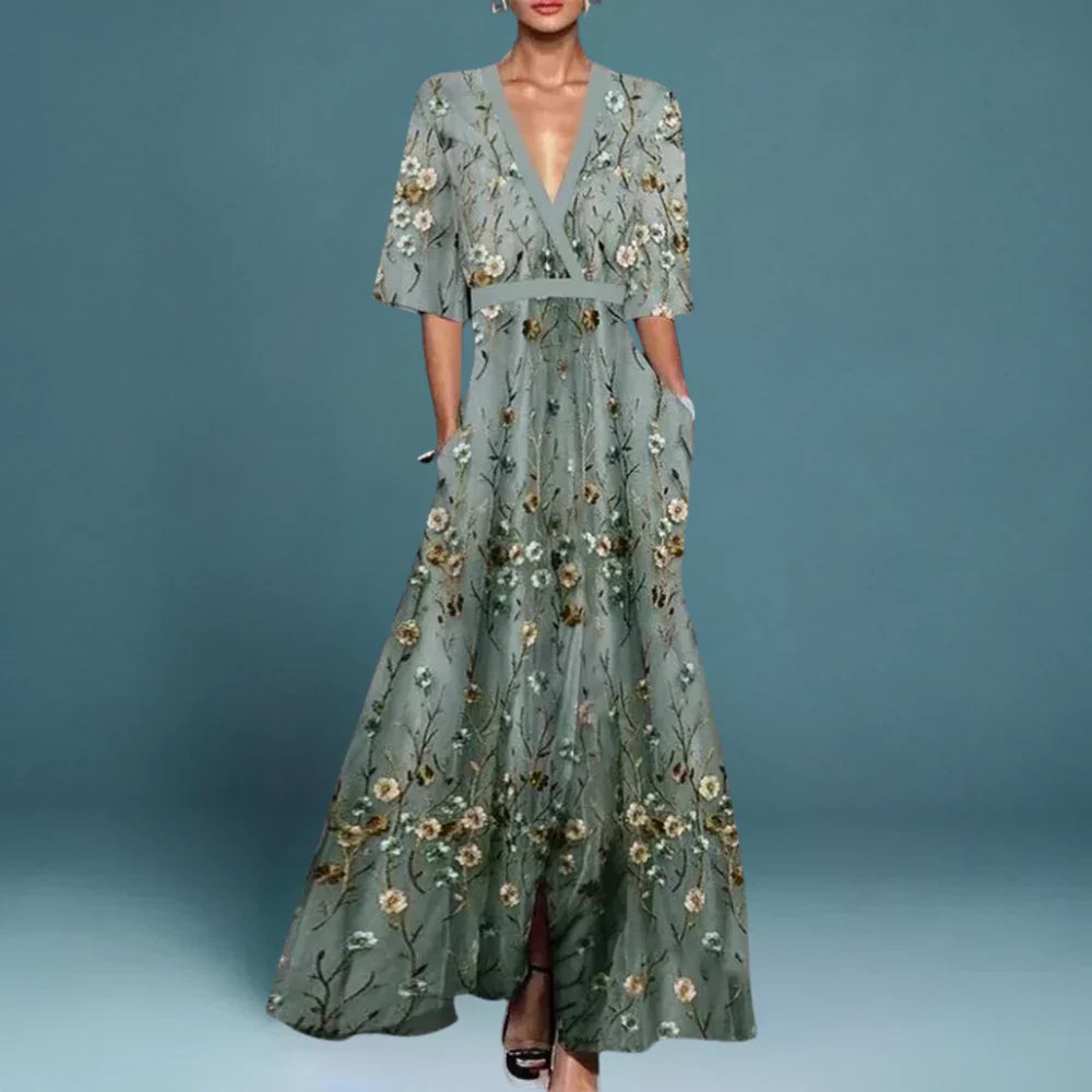 Sage green maxi dress with gold and white floral embroidery — front view