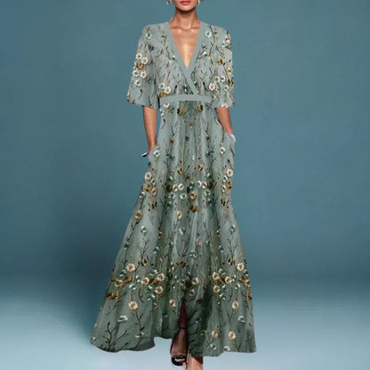 Sage green maxi dress with gold and white floral embroidery — front view