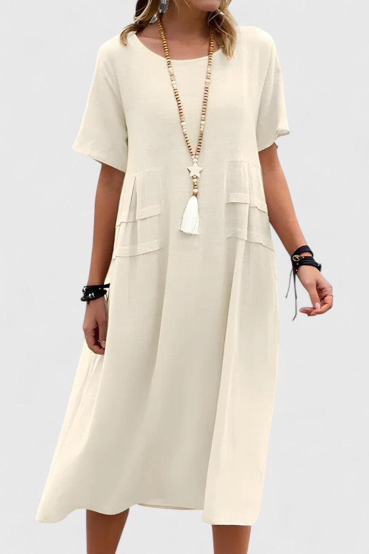 Cream midi dress with tiered pockets and short sleeves — front view