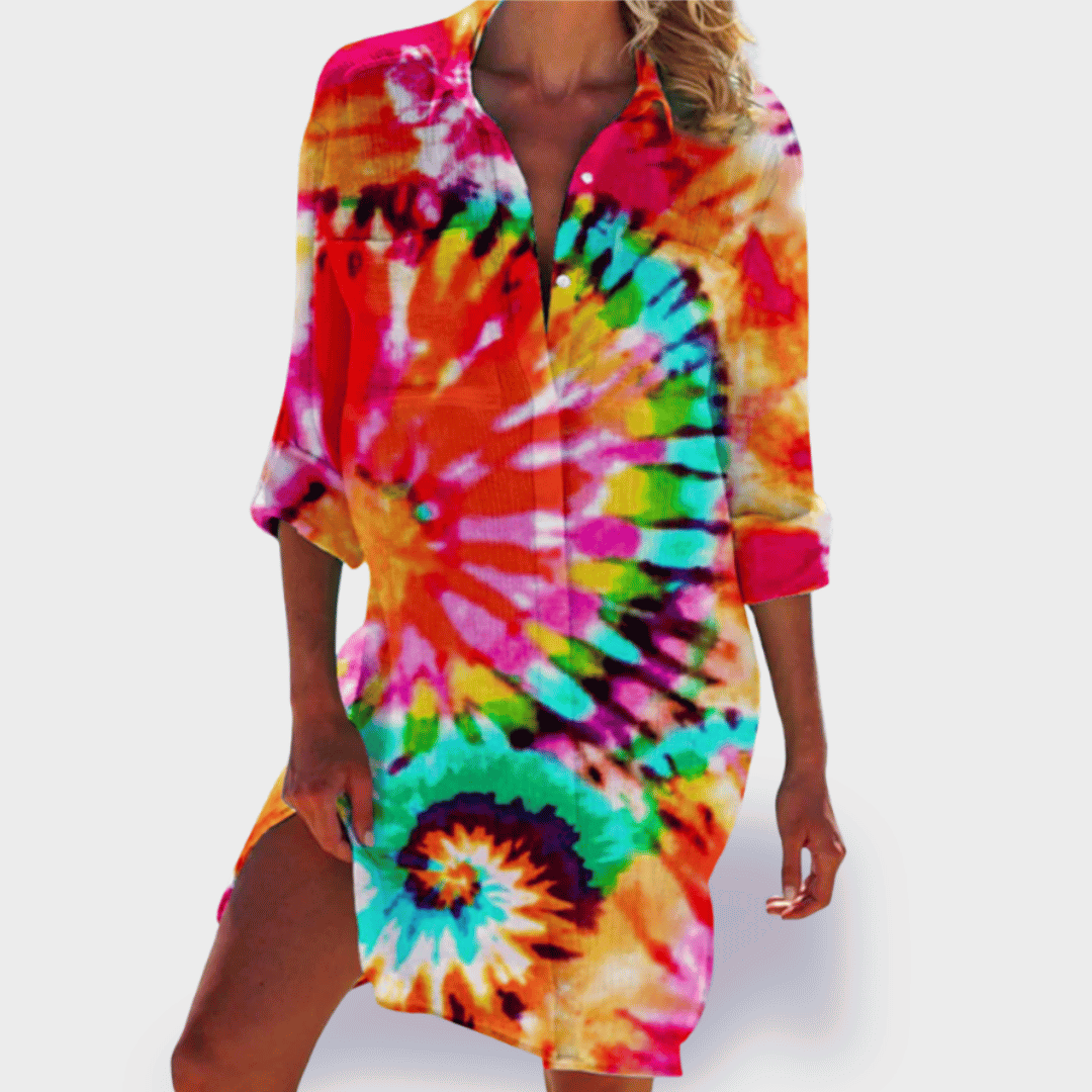 Vibrant tie-dye maxi shirt dress with rainbow swirl pattern — front view