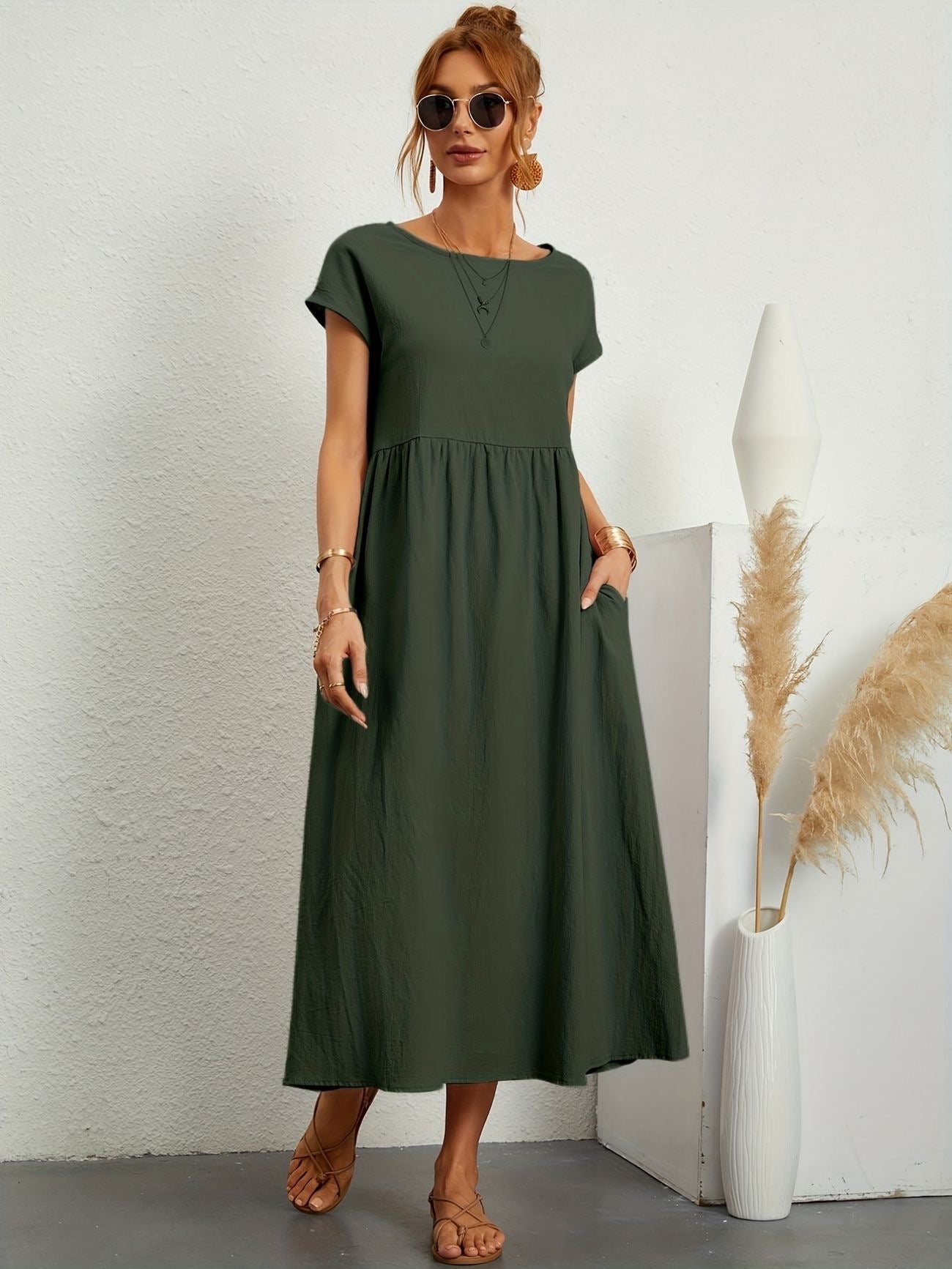 Olive green short sleeve midi dress with gathered waist and pockets — front view
