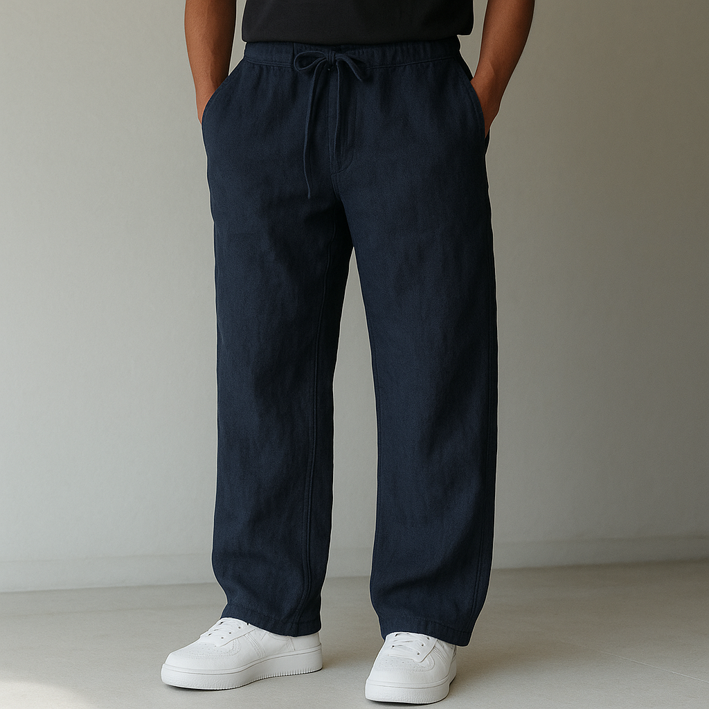 Navy linen drawstring pants with relaxed fit and side pockets — front view