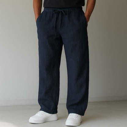 Navy linen drawstring pants with relaxed fit and side pockets — front view