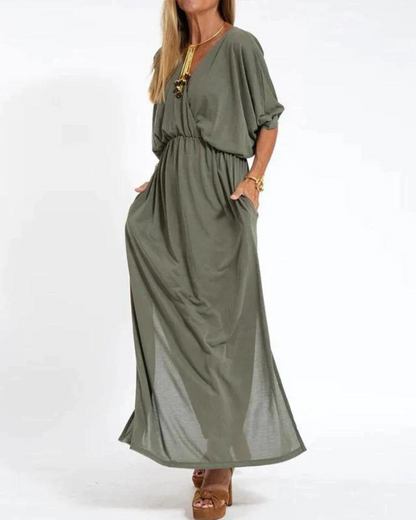 Olive green flowy maxi dress with cinched waist and short sleeves — side angle view