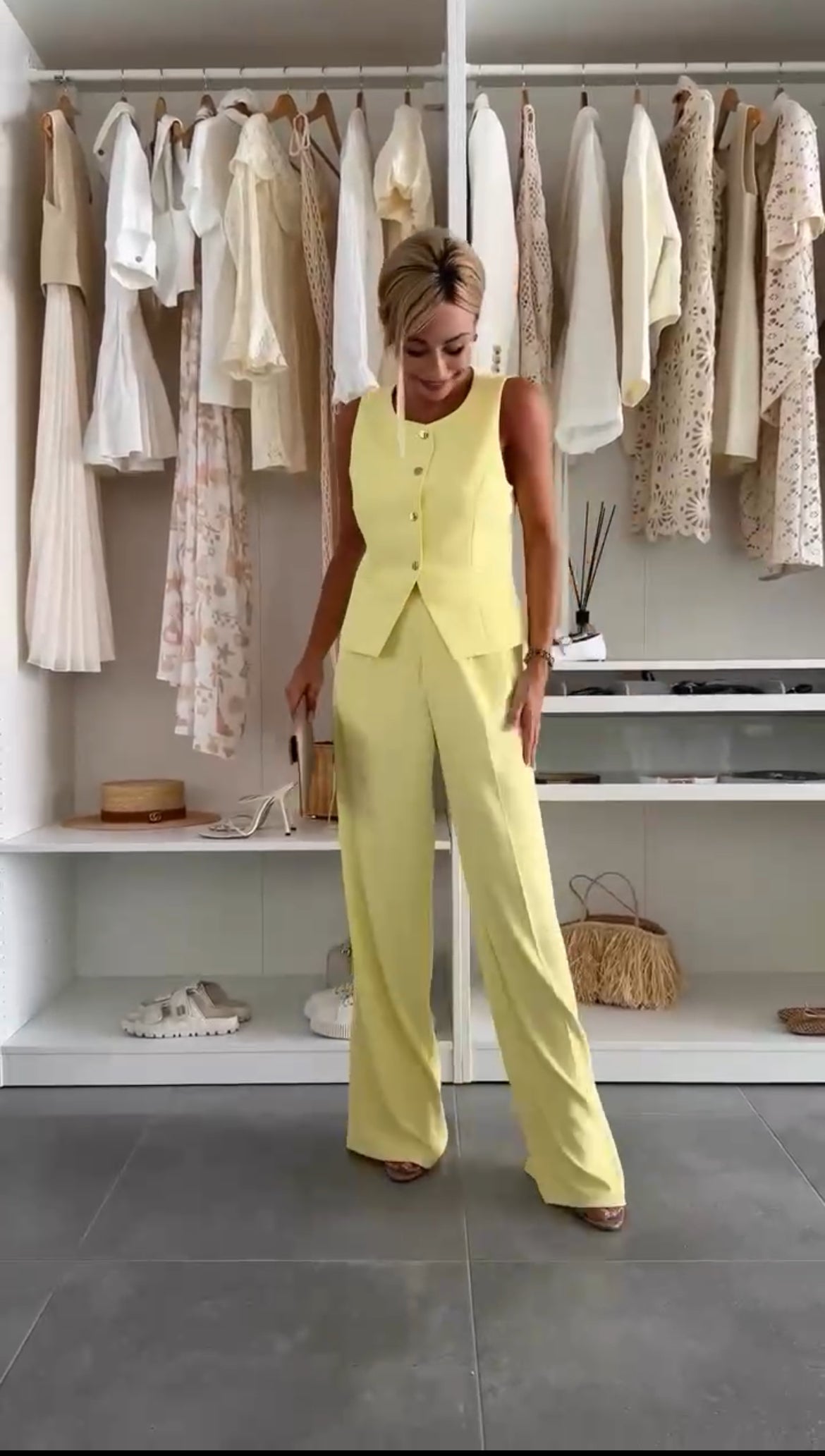 Yellow sleeveless vest and wide-leg trousers co-ord set — front view in walk-in closet