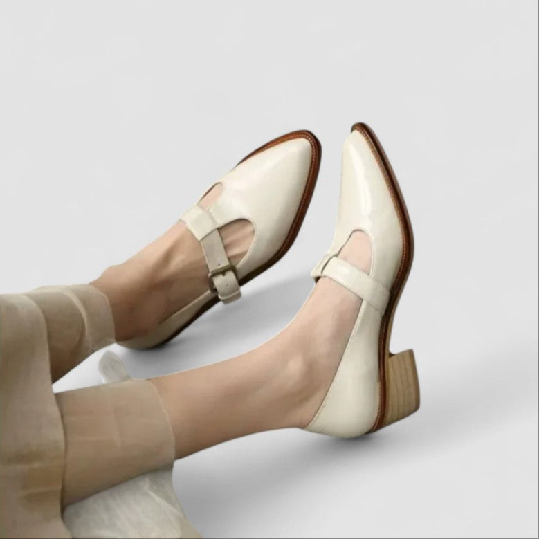 Cream orthopedic Mary Jane shoes with adjustable strap and block heel — side view on feet