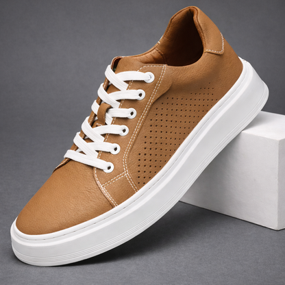 Brown leather sneaker with white laces and perforated detail on white platform sole — side angle view