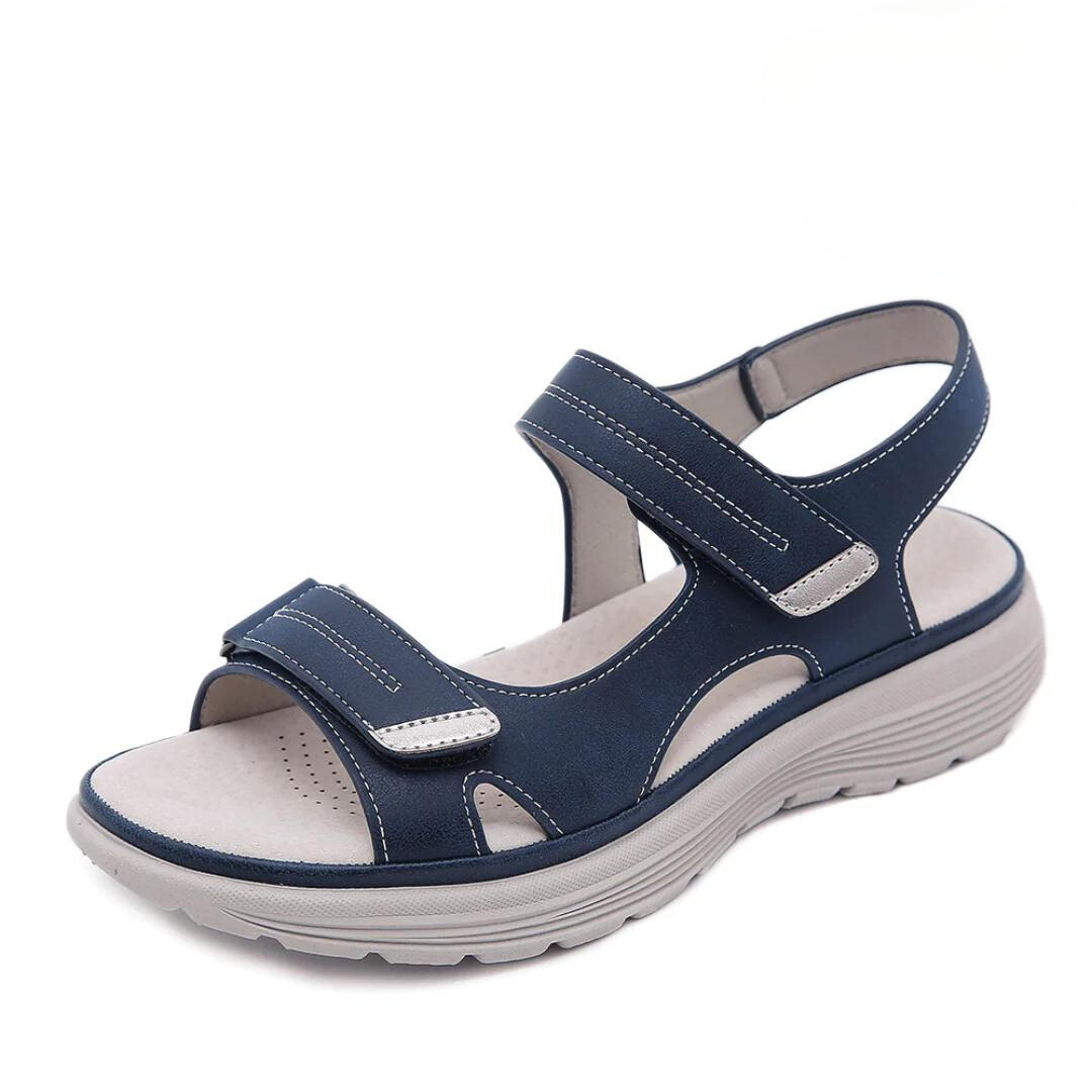 Navy blue orthopedic sandal with dual velcro straps and grey sole — side view