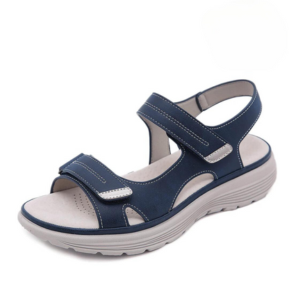 Navy blue orthopedic sandal with dual velcro straps and grey sole — side view