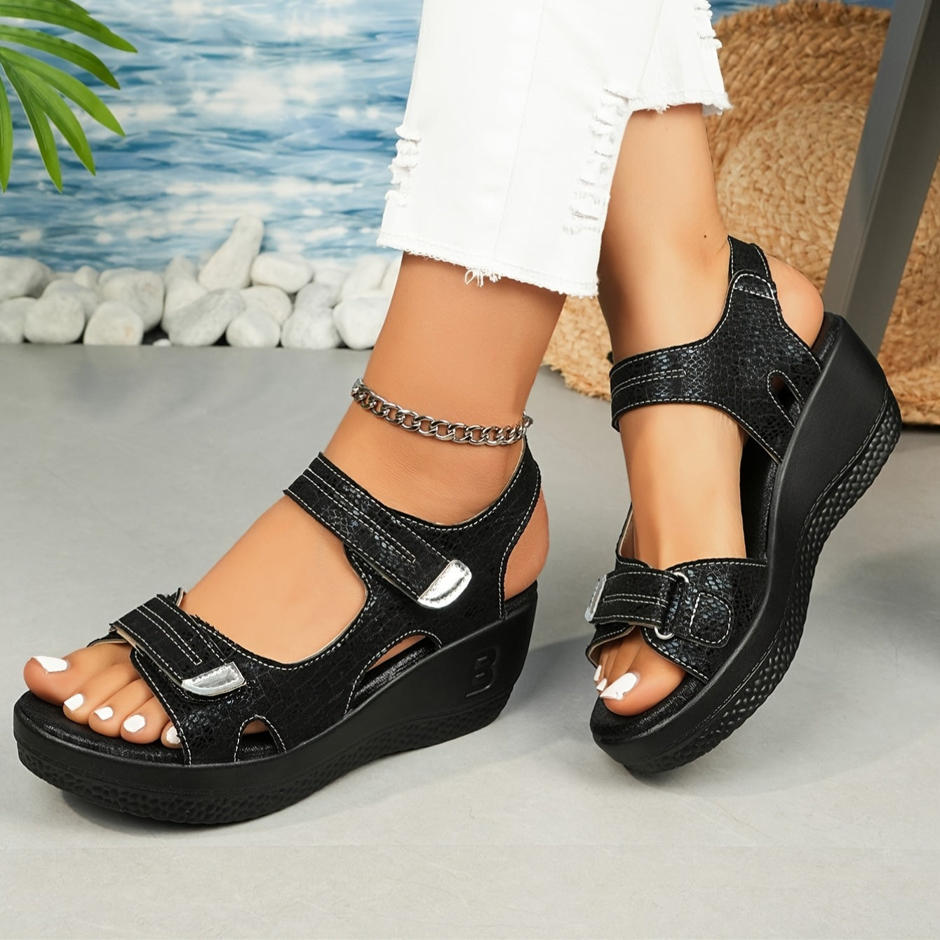 Black platform wedge sandals with adjustable hook-and-loop straps — front three-quarter view