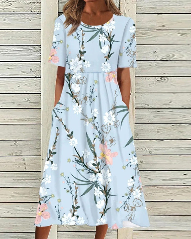 Light blue floral midi dress with pink flowers and green leaves, front pockets — front view