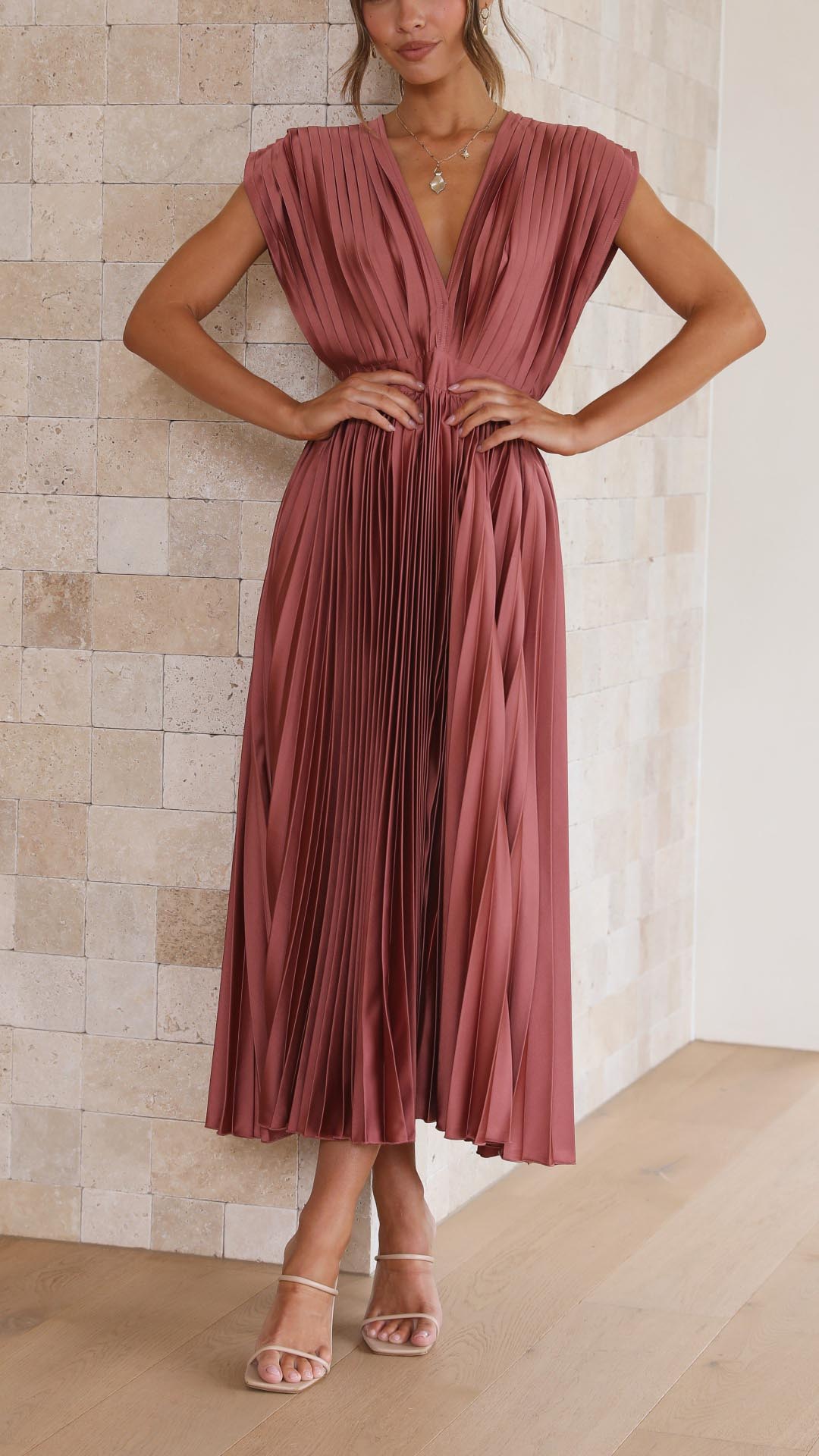 Dusty rose pleated maxi dress with deep V-neck and cap sleeves — front view