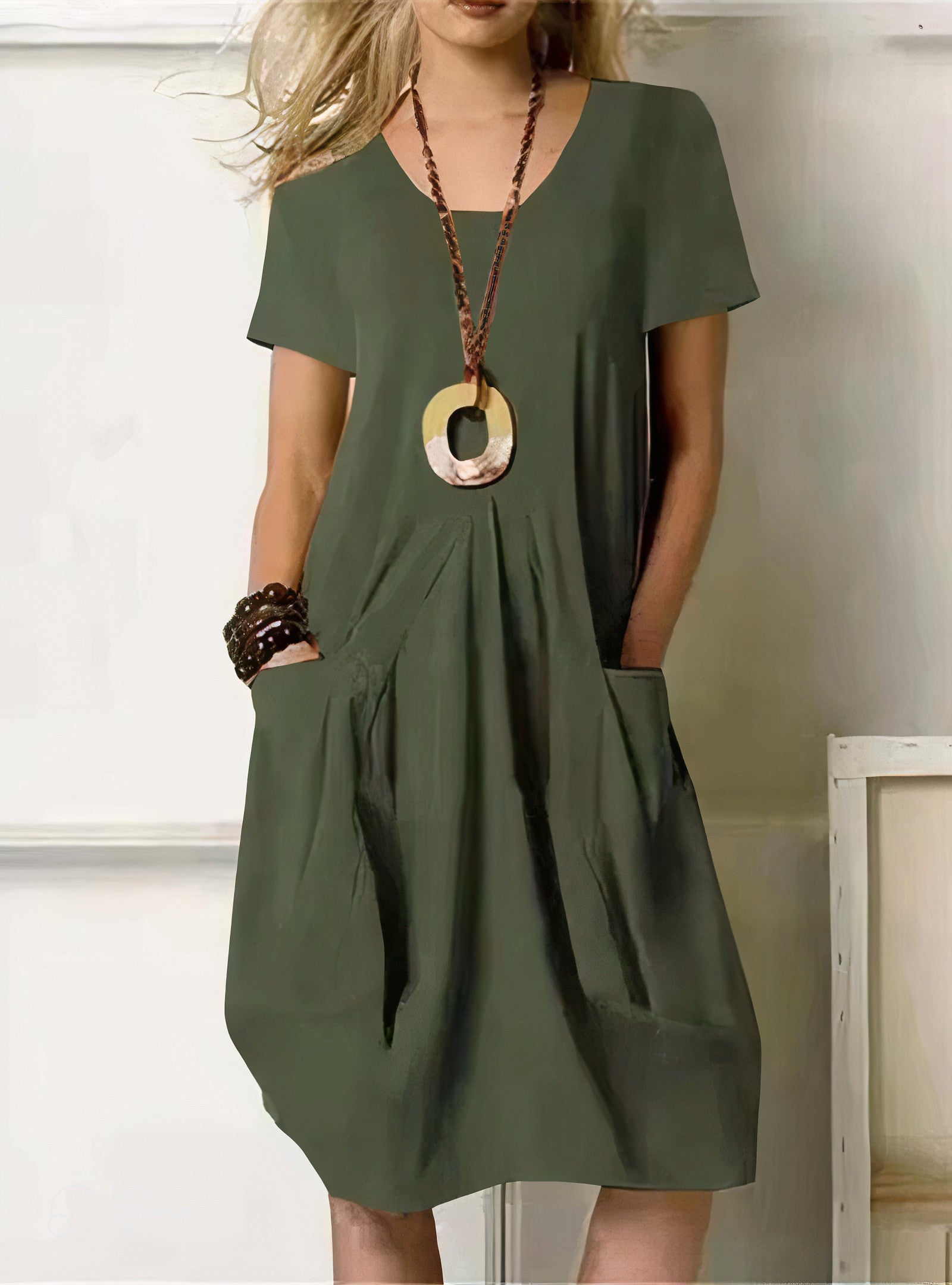 Olive green short-sleeve midi dress with side pockets and pleated detail — front view