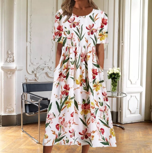 Women's white midi dress with red and yellow floral print — front view on model