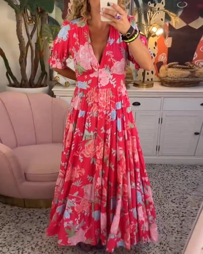 Floral red maxi dress with flutter sleeves and tiered skirt — mirror selfie view