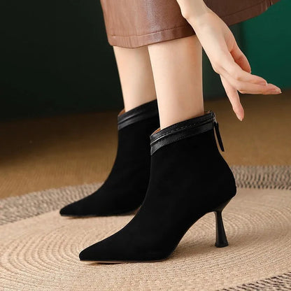 Black suede pointed-toe ankle boots with kitten heels — side view