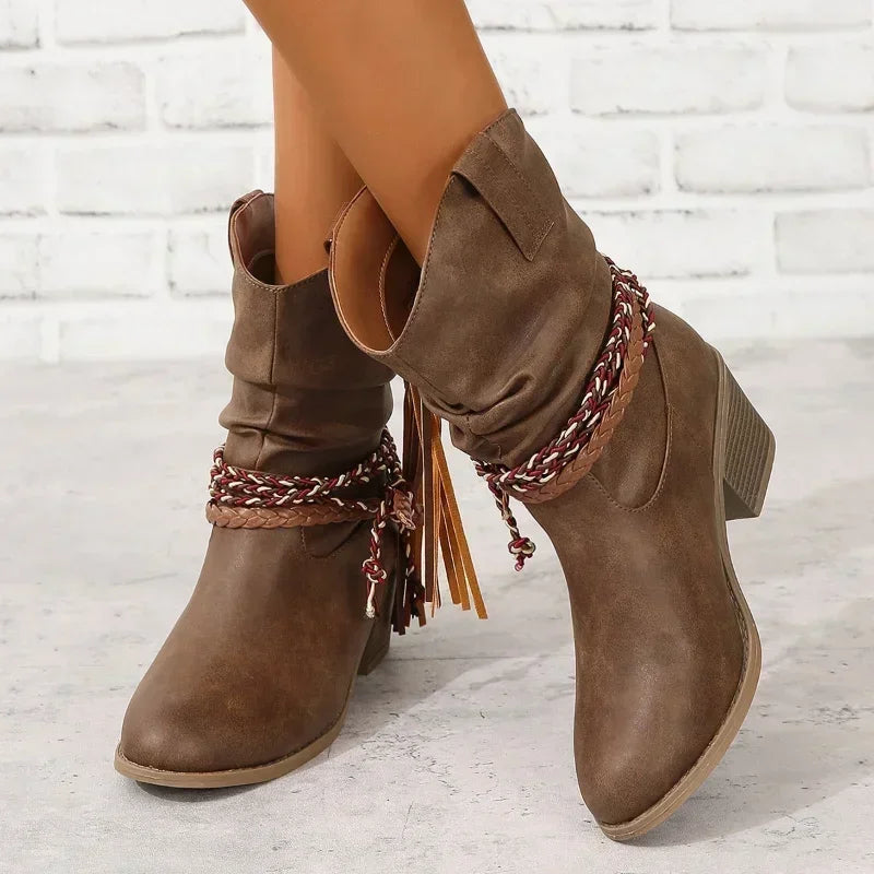 Women's taupe suede western mid-calf boots with braided straps and fringe detail — front angled view