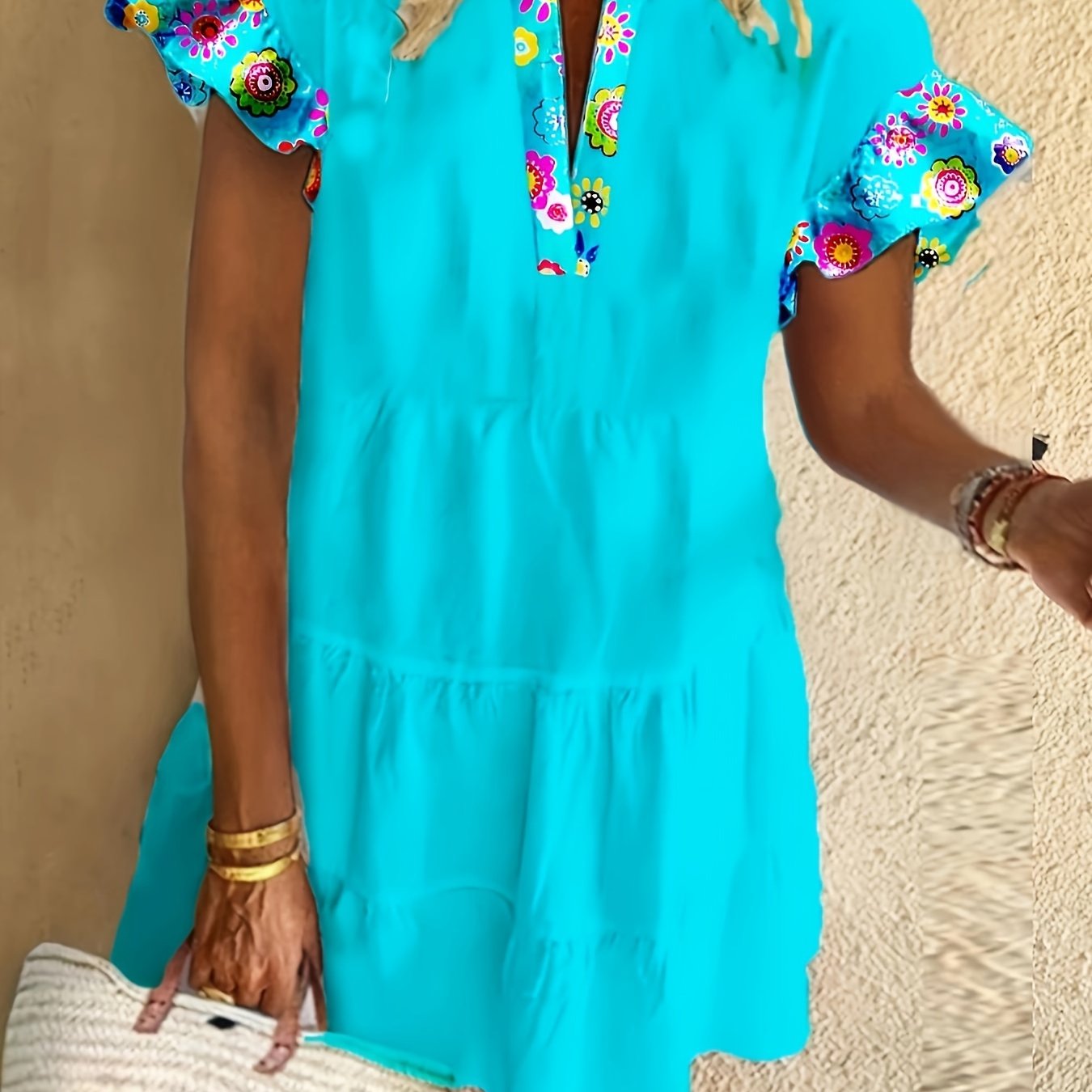 Turquoise boho midi dress with colorful floral printed sleeves and tiered skirt — front view