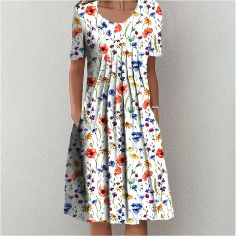 White midi dress with colorful wildflower print and short sleeves — front view on model