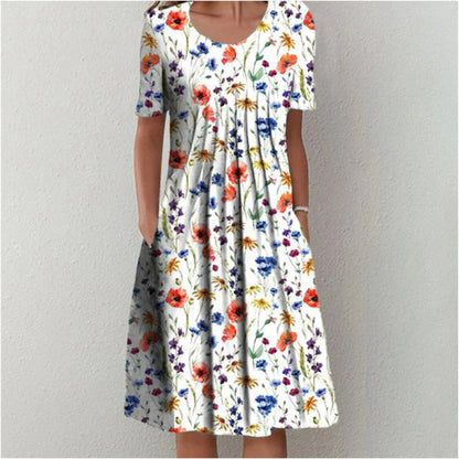 White midi dress with colorful wildflower print and short sleeves — front view on model