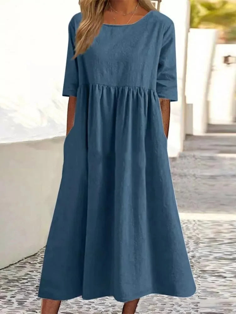 Women's blue linen midi dress with empire waist and half sleeves — front view