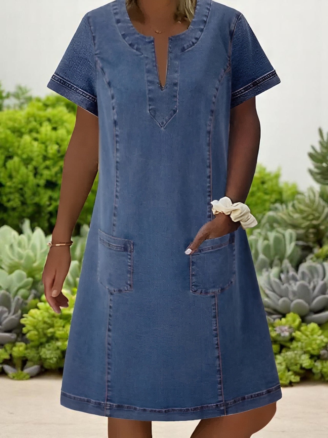 Denim midi dress with V-neck, short sleeves, and front pockets — front view