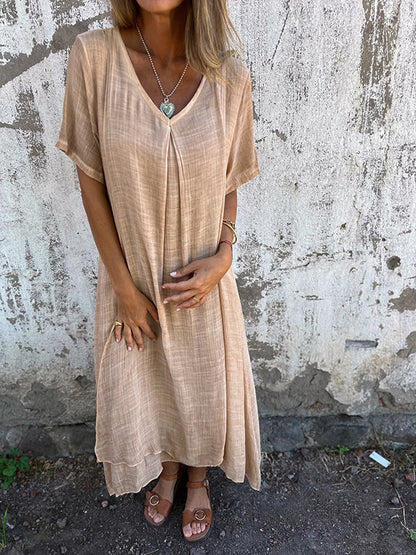 Women's beige v-neck midi dress with short sleeves and relaxed fit — front view