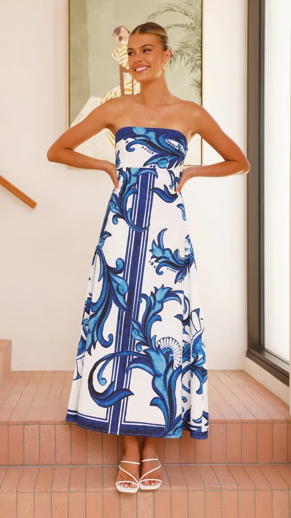 Strapless maxi dress with blue baroque print on white background — front view