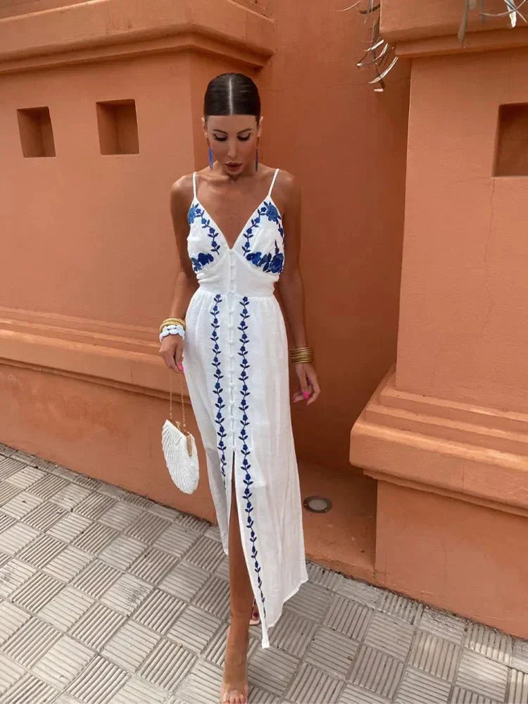 White maxi dress with blue embroidered details and front slit — full body front view