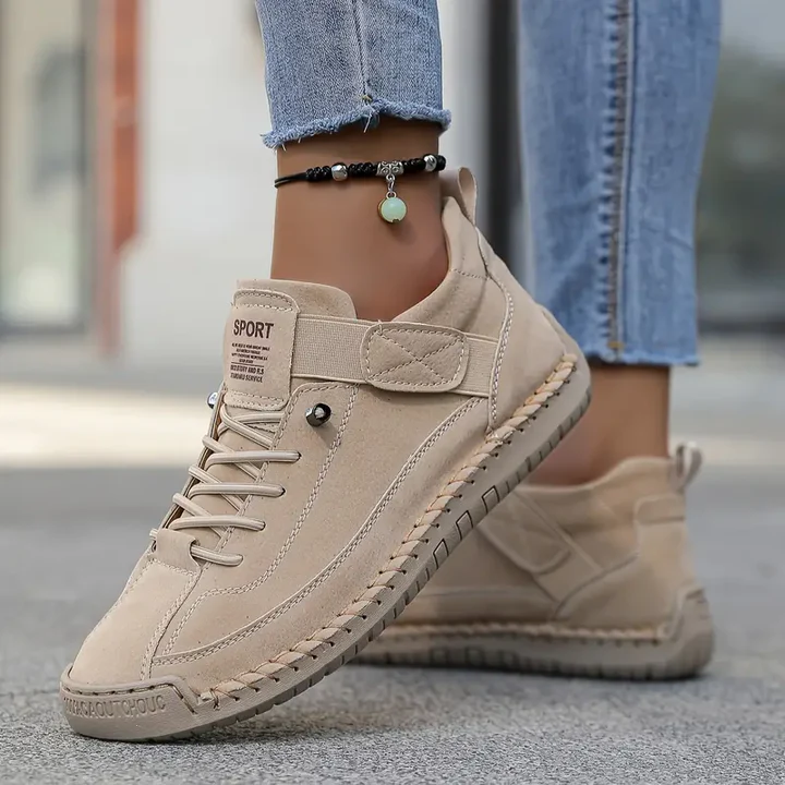 Beige orthopedic sneakers with velcro strap and lace-up design — side angle view