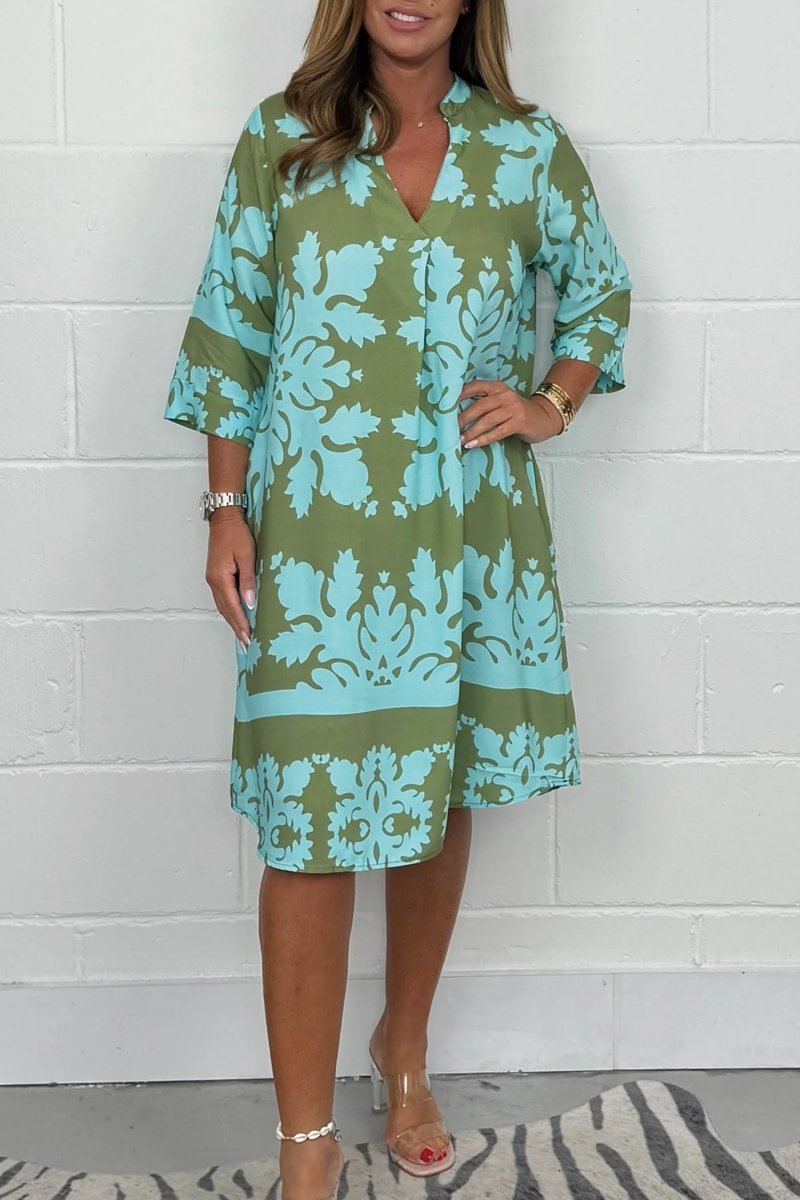 Women's olive green and turquoise floral print midi dress with bell sleeves — front view