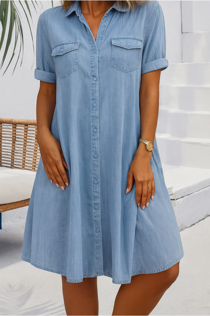 Light blue denim shirt dress with button front and rolled sleeves — front view