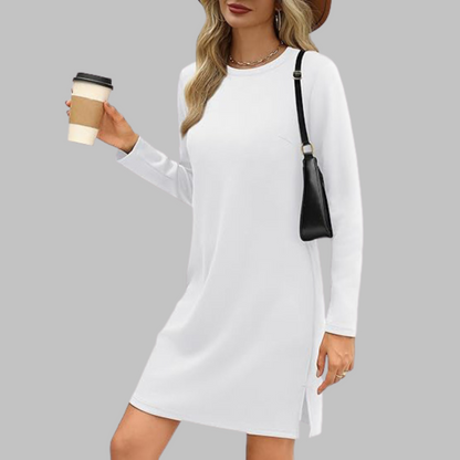 White long sleeve midi dress with side slit — front view on model holding coffee cup
