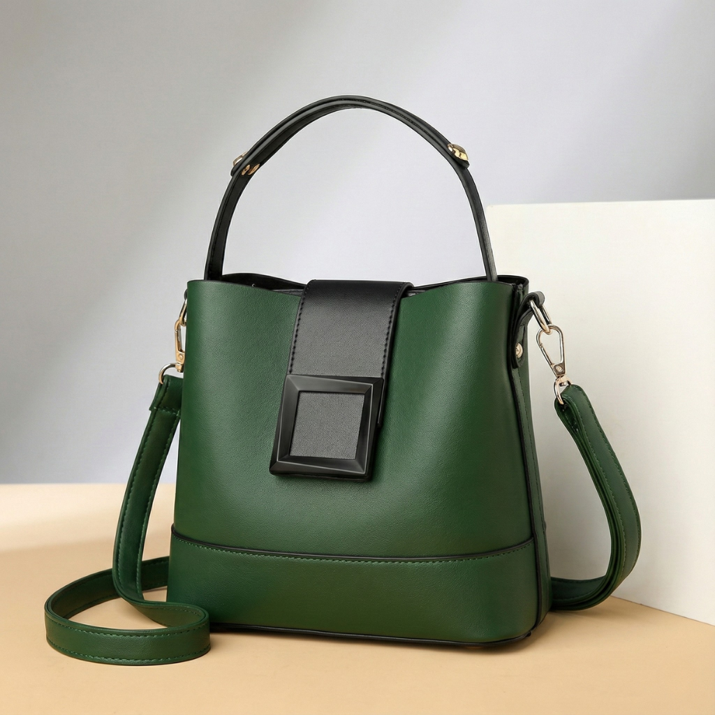 Green leather handbag with black accent flap and top handle — front three-quarter view