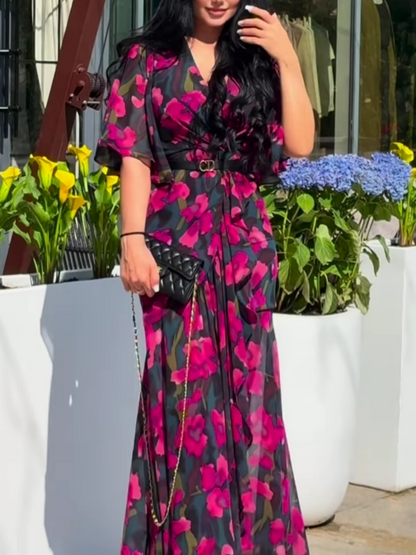 Women's floral printed midi dress with pink flowers on dark background — front view