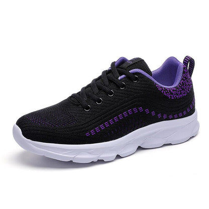 Black and purple women's orthopedic walking sneaker with white chunky sole — side view