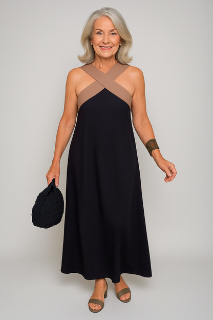 Black maxi dress with taupe cross-neck straps and A-line silhouette — front view